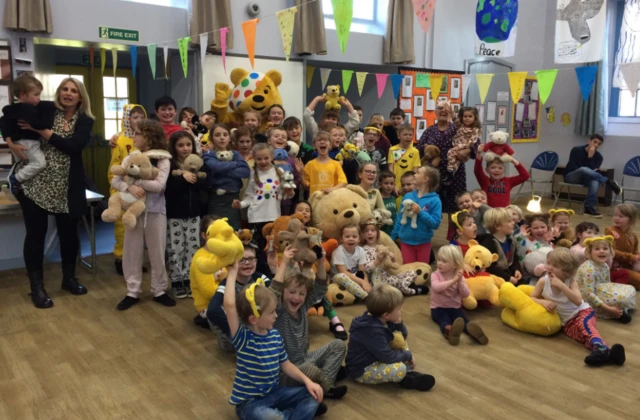 Pudsey surrounded by children at Caldbeck