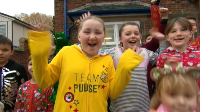 Children at Clifton CE Primary School wearing a onesie