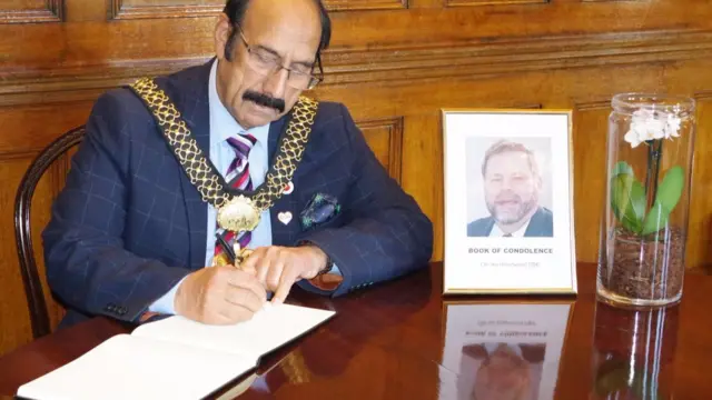 Lord Mayor signing the book of condolence