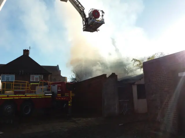 Aerial ladder and lots of smoke