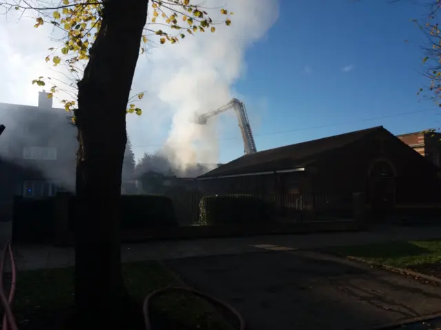 Aerial ladder and lots of smoke