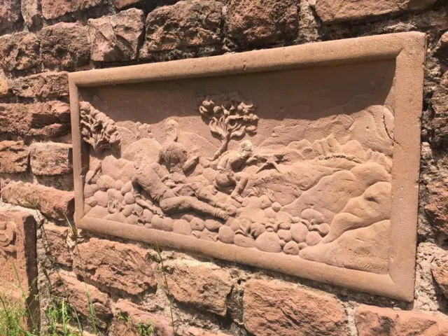 Frieze on the wall of the cemetery