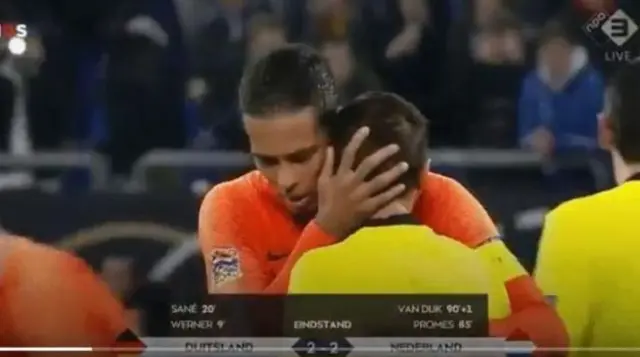 Referee Ovidiu Hategan consoled by Liverpool defender Virgil van Dijk