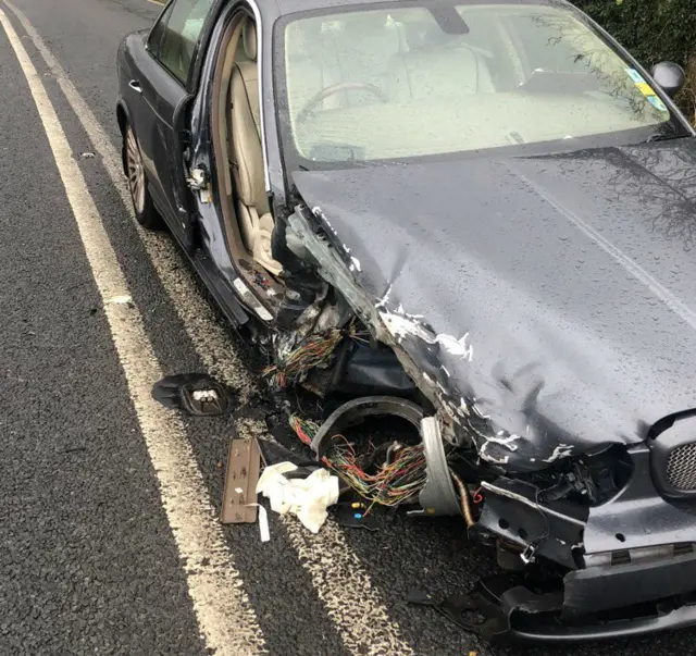 A car with a damaged front wing