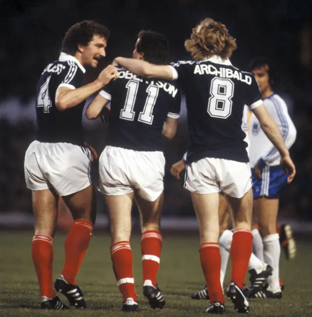 John Robertson is congratulated by Graeme Souness and Steve Archibald