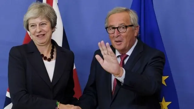 Theresa May and Jean-Claude Juncker.