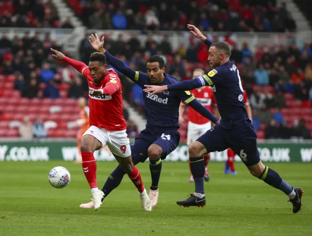 Britt Assombalonga dances with the Derby defence