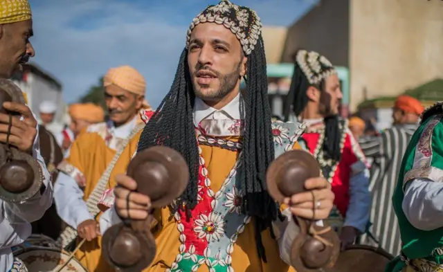 Muslims in Morocco celebrating the birthday of the Prophet Muhammad with a procession in the town of Sale