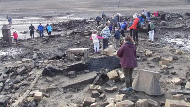 People on the reservoir bed