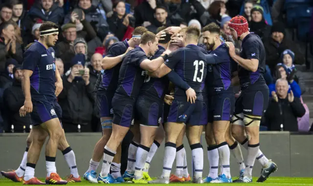 Scotland players celebrate Sean Maitland's try