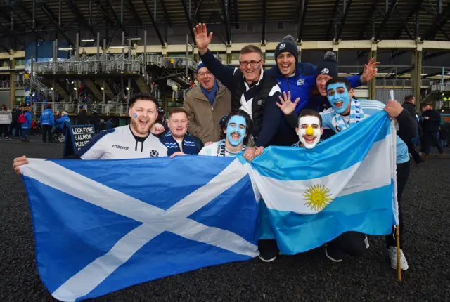 Scotland and Argentina fans pose with flags pre-match at Murrayfield