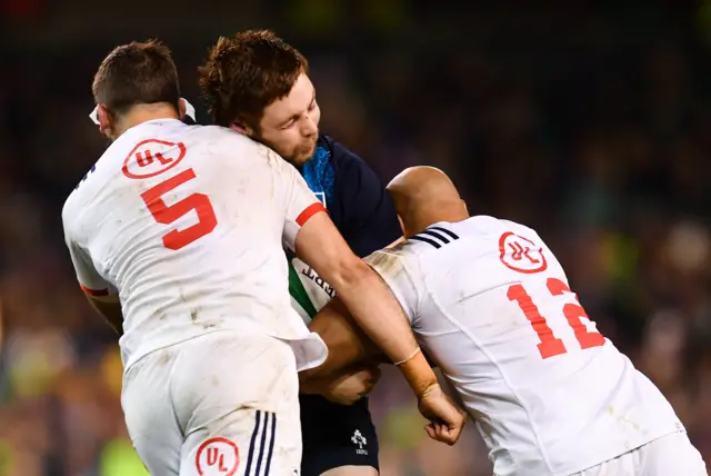 Iain Henderson of Ireland is tackled