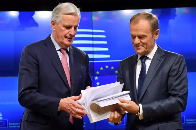 EU chief negotiator Michel Barnier (L) and European Council President Donald Tusk