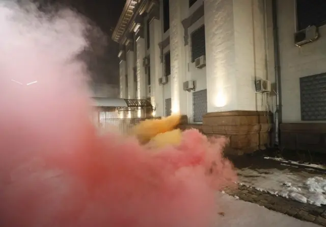 A burning flare in front of the Russian embassy in Kiev