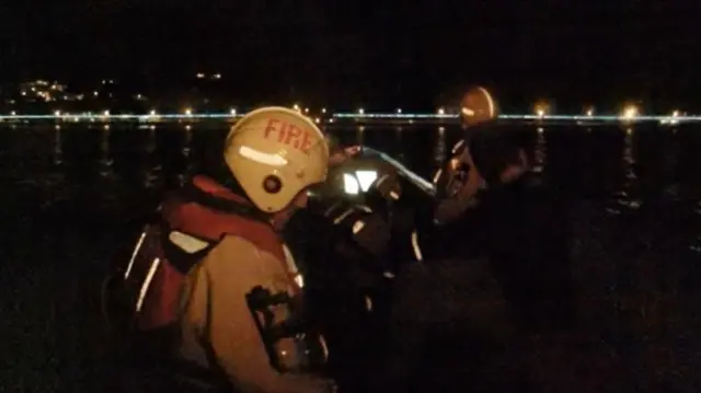 Jersey Fire & Rescue Service staff attempting the rescue in St Aubin Bay