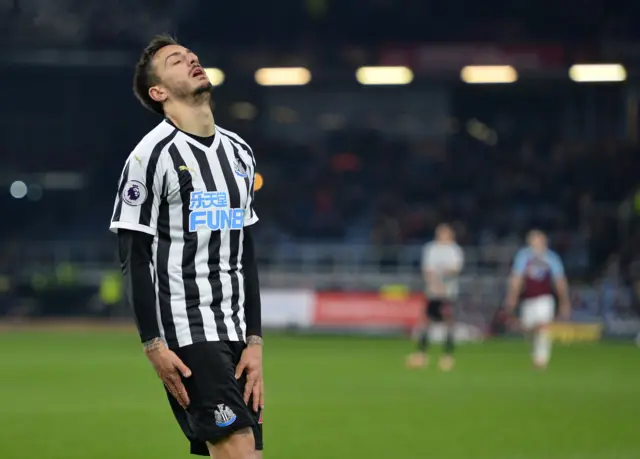 Joselu reacts after hitting the post