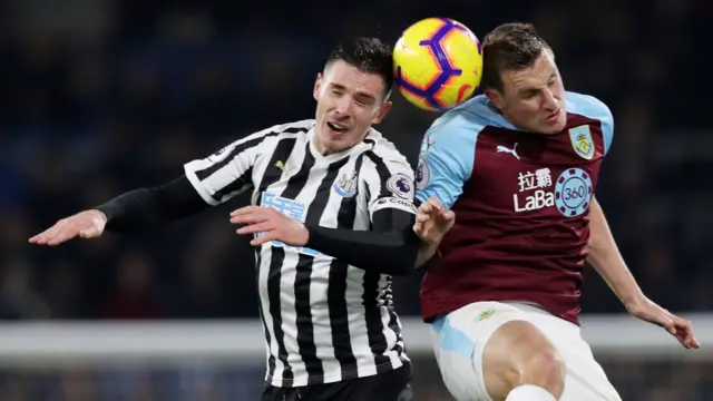 Ciaran Clark heads clear