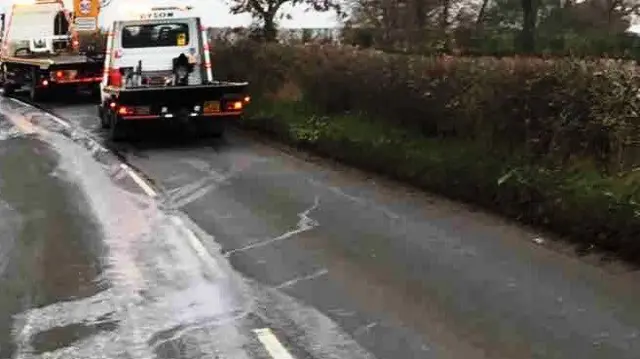 Oil spilt across road