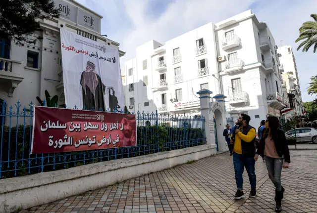 a banner hanging outside Tunisia"s Journalists Union in the capital Tunis depicting Saudi Crown Prince Mohammed bin Salman with a caption reading in Arabic "no welcomes to bin Salman in Tunisia, the land of the revolution"