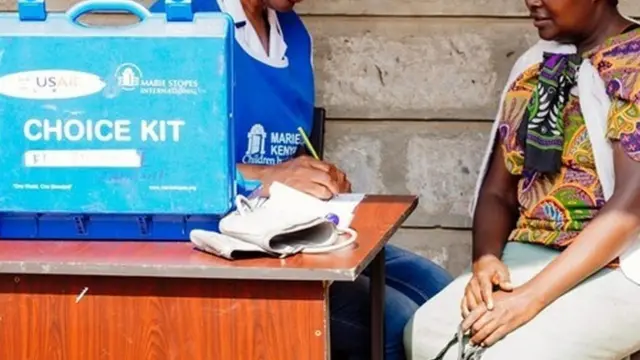 A Marie Stopes health worker speaks to a patient