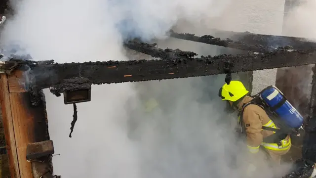 A firefighter using breathing apparatus