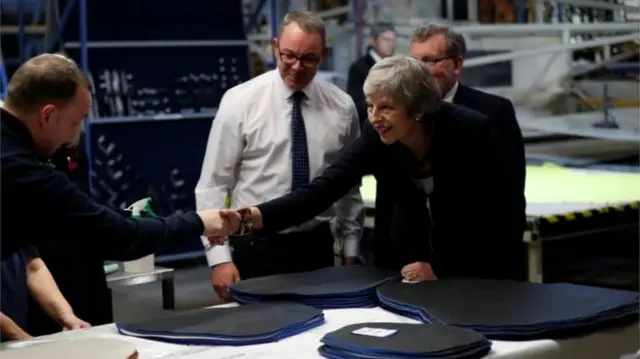 Mrs May met workers at the Scottish Leather Group factory in Bridge of Weir