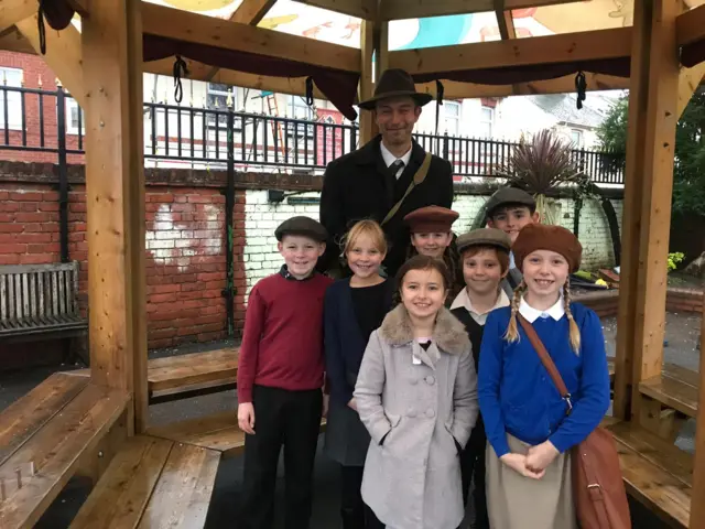 Children dressed as young evacuees