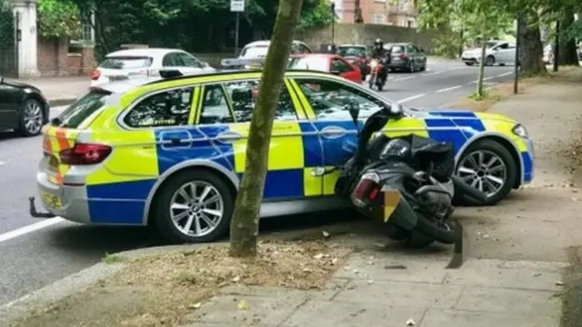 Police car and moped crash