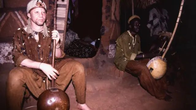 Salif Keita (left) playing the kora in Mali