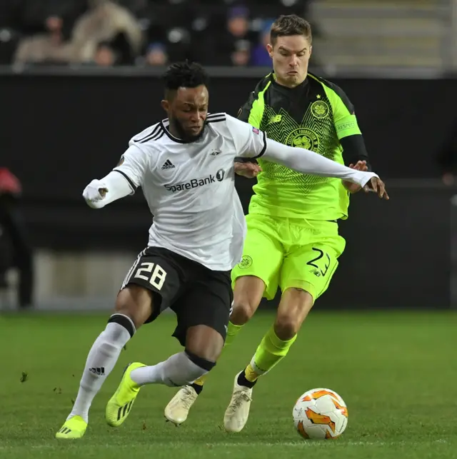 Rosenborg's Samuel Adegbenro holds off Celtic defender Mikael Lustig