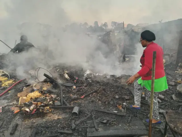 Woman at torched market