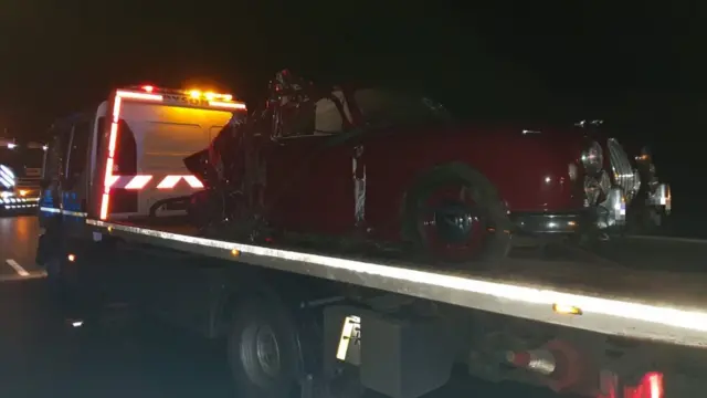 Smashed up car on a recovery trailer