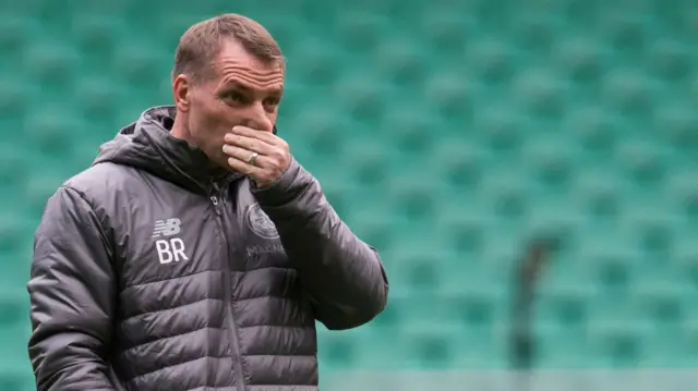 Celtic manager Brendan Rodgers looks pensive in training