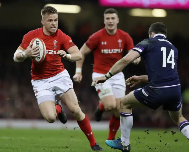 Wales' Gareth Anscombe takes on Scotland wing Tommy Seymour