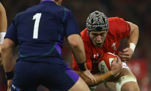 Dan Lydiate runs with the ball for Wales against Scotland