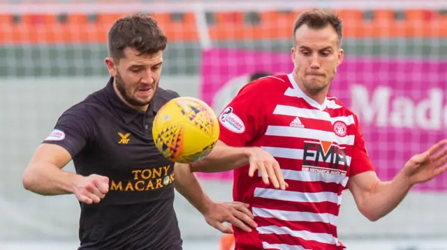 Livingston's Craig Halkett battles with Hamilton's Fredrik Brustad