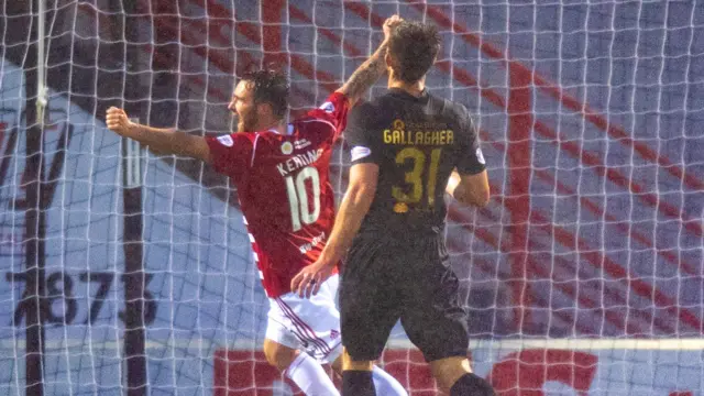 Hamilton's James Keatings (centre) celebrates Hamilton's late goal