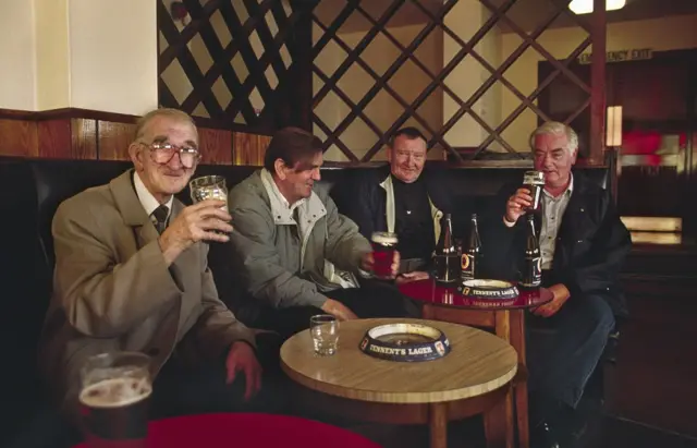 Men drinking in a pub