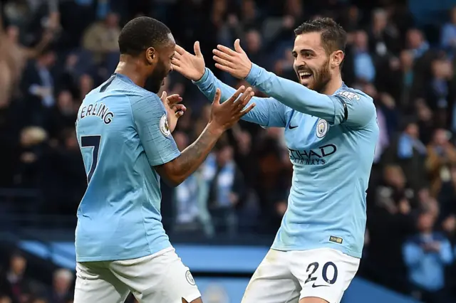 Raheem Sterling celebrates with Bernardo Silva