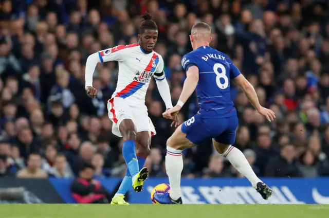 Wilfried Zaha takes on Ross Barkley