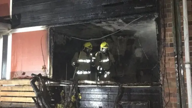 Firefighters inside house