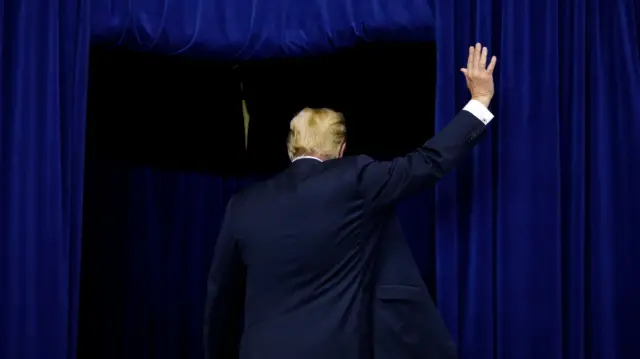 Donald Trump waves