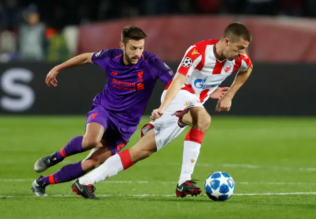 Crvena Zvezda's Dusan Jovancic and Liverpool's Adam Lallana