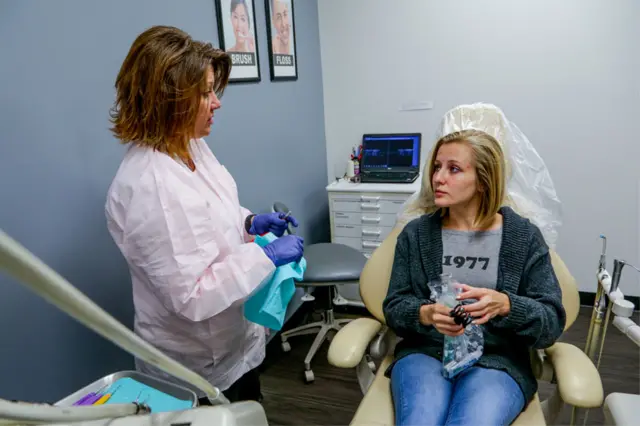 Young woman in dental chair