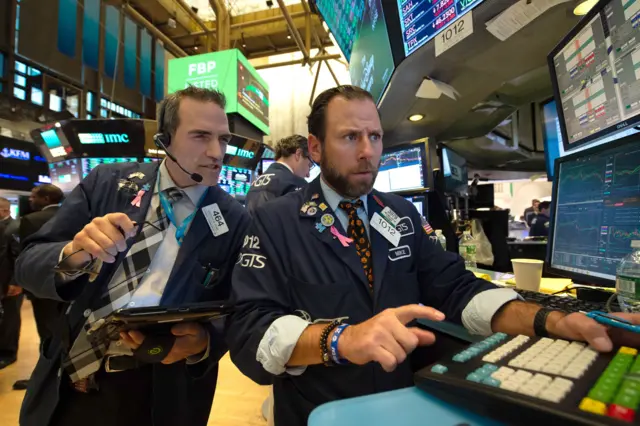 Traders at the New York Stock Exchange. File photo