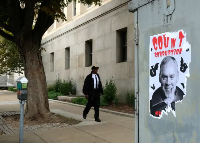 A Halloween themed anti-Zinke poster outside the US Department of the Interior