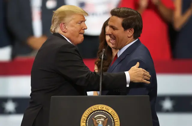 President Donald Trump greets Florida Republican gubernatorial candidate Ron DeSantis at rally