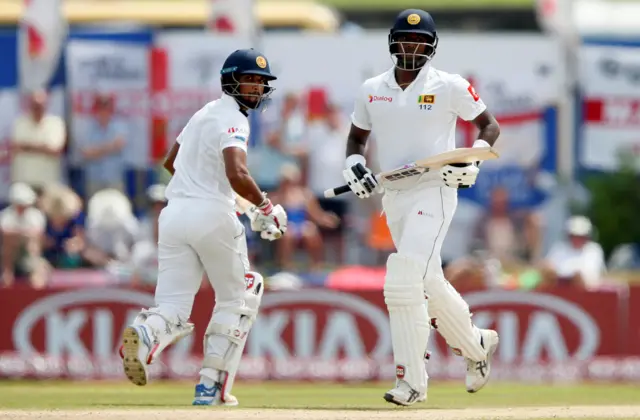 Sri Lanka's captain Dinesh Chandimal and Angelo Mathews run between wickets