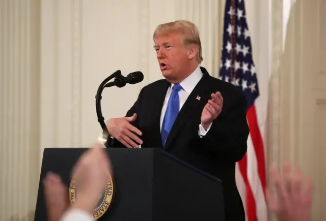 President Donald Trump answers questions after giving remarks a day after the midterm elections