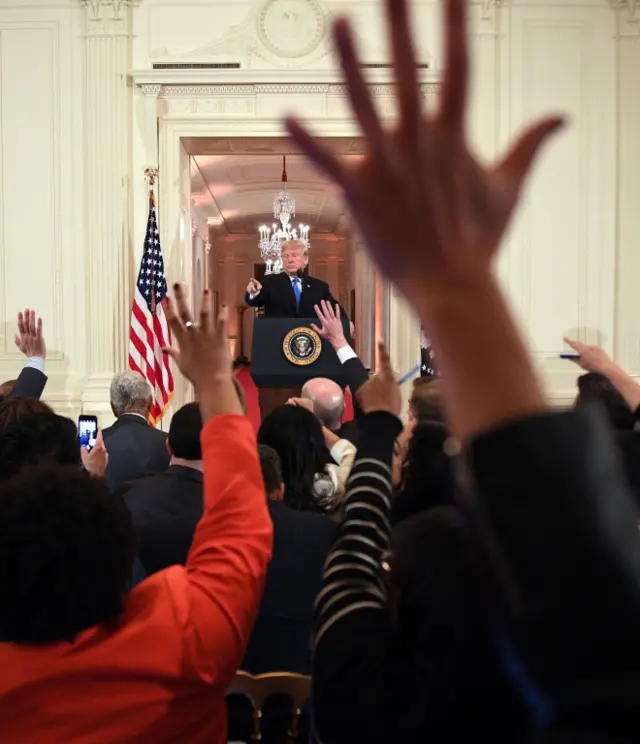 US President Donald Trump speaks during a press conference in the East Room of the White House in Washington